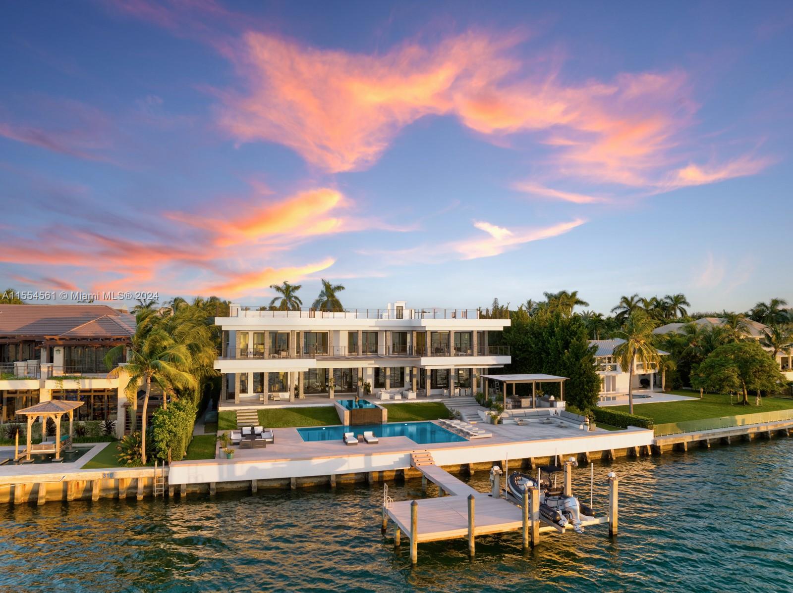Designed by world-renowned architect Ramon Alonso of Miami-based Studio Radyca. He is behind the designs of some of the world’s most exciting homes, yachts, and planes. Completed in 2014, this home sits directly on Biscayne Bay with 120 ft of water frontage. Boasting what is probably the most exciting residential water view of Miami’s Downtown Skyline, and stunning open bay sunsets. This home features a private dock, rooftop pickleball court, expansive balconies, soaring ceilings, and unobstructed wide water views from virtually every room. A complete bonus entertainment level including a full gym, spa, sauna, and home theater. Designed for large-scale indoor and outdoor entertaining.