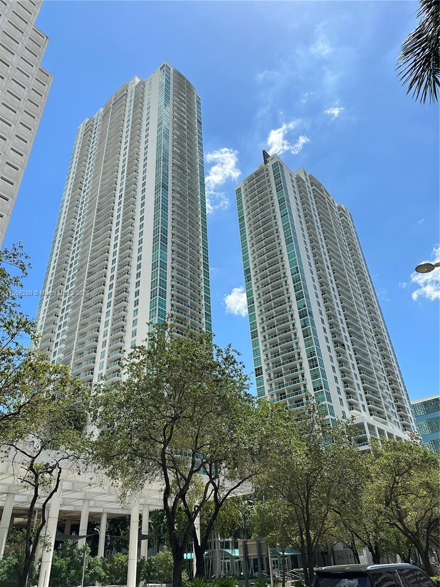 Live in the heart of Brickell! Largest 1 BR line at The Plaza on Brickell with views of the pool area, bay, and Brickell Ave. This corner unit is sleek and modern with designer upgrades. Italian concrete-look porcelain tile throughout the unit and balcony. Spa-inspired bathroom with high-end fixtures including rain shower! The airy bedroom has floor to ceiling windows and large walk-in closet. Granite countertops and stainless steel appliances in the kitchen. Modern features including Nest thermostat and motion sensor lighting make this condo special. The building has a resort-style pool area with 2 large pools, full gym with sauna, business center, theater room, and club room. Short walk to Publix, WholeFoods, Brickell City Centre, restaurants, and Metromover. Available July 1, 2024.