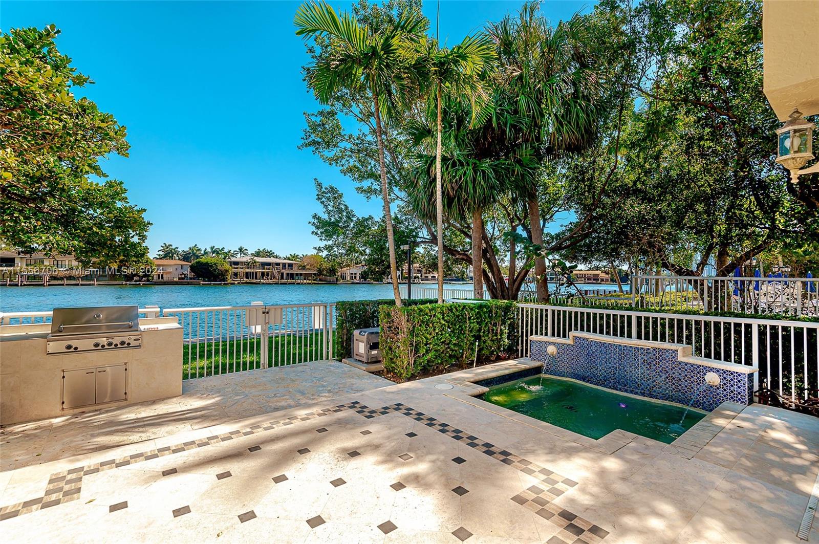 Corner unit, directly on the Intracoastal waterway with fantastic views, deeded boat dock, the unit has the largest driveway that can fit at least 8 cars plus 2 car garage. Separate entrance full bedroom with full bathroom. Beautiful eat in kitchen, marble floors first floor, wood floors second floor, spa in the backyard, built-in grill and it's conveniently located next to the community pool. Maintenance includes the use of the community spa, tennis courts, security gate house, walk to the Waterways shops and Aventura Mall is just minutes away. The property is currently rented, please do not disturb the tenants and call the listing agents for access to show. Only 60 townhomes in the complex, gated community