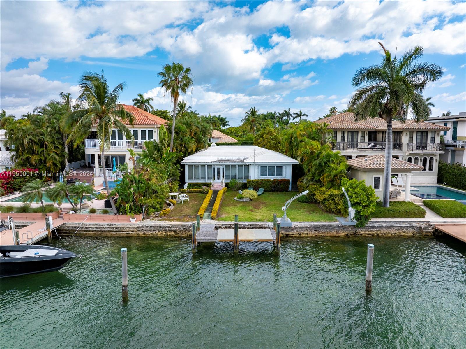 Location & Price! The best of both worlds. This never before listed premier Hibiscus Island property is now available and perfect for someone looking to knock down and create their own style Dream house of waterfront property with the best sticker price. This timeless piece is within 5 minutes driving to Miami's Beaches, Cruise lines and Miami's Downtown area. The island offers private tennis courts and playground for their residents. Property will require the seawall to be repaired. Except for seawall repairs the house is charming with unique characters of the 1950's.