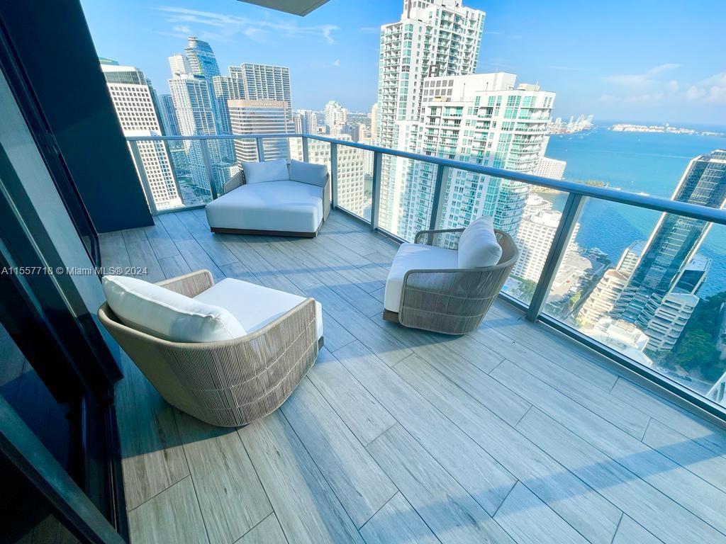 FULLY FURNISHED  upgraded condo at 1010 Brickell. Professionally furnished unit has 3 beds + DEN, 3 baths, private elevator,  11-foot ceiling height, blackout & transparent shades & a  large balcony with stunning water & city views.  Building Amenities -  rooftop swimming pool/hot tub & restaurant/bar on the 50th floor,  outdoor movie theater, unisex Hammam spa with cold plunge pool & indoor hot tub, massage rooms, sauna & steam room, indoor basketball court, racquetball court, running track, heated indoor swimming pool, large fitness center with separate yoga/class studio room, club room w kitchen, kids game room with bowling, virtual golf and more. Excellent location next to restaurants, MetroMover,  & Financial District. NO PETS **AVAILABLE JUNE 1st  to NOV 30th 2024 ONLY **