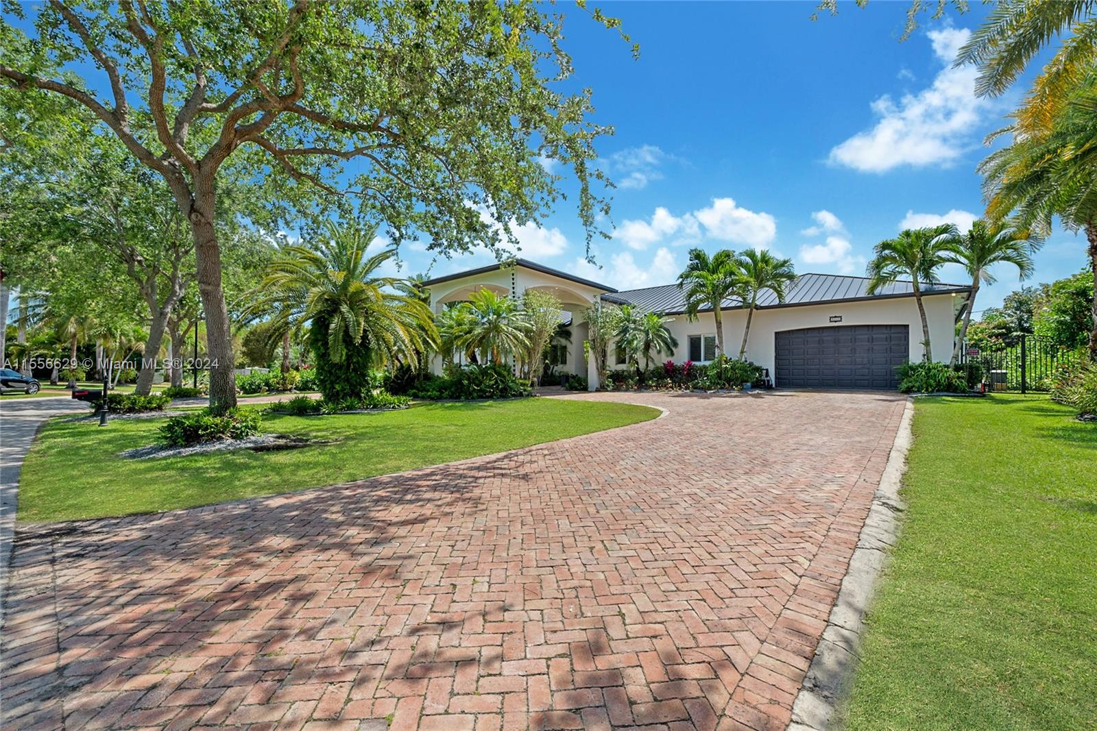 Come discover this captivating 1-story home with 5,319 sf in Palmetto Bay.  Enjoy 5 bedrooms, 1 office, and 5 baths in this modern oasis. Revel in marble floors, a lavish master suite, and a gourmet kitchen. Outdoors, find a fully-equipped gazebo with an outdoor kitchen, custom made coral rock firepit, and pristine pool, perfect for an active family lifestyle. Updated in 2021 with a new roof, A/C, and freshly painted exterior. In addition this family home includes plantation shutters, impact windows & California closets throughout. Located on a quiet desirable street, near top private schools such as Palmer Trinity and Westminster Christian, and beautiful parks, this home offers a perfect blend of luxury and convenience. Your dream Palmetto Bay lifestyle awaits!