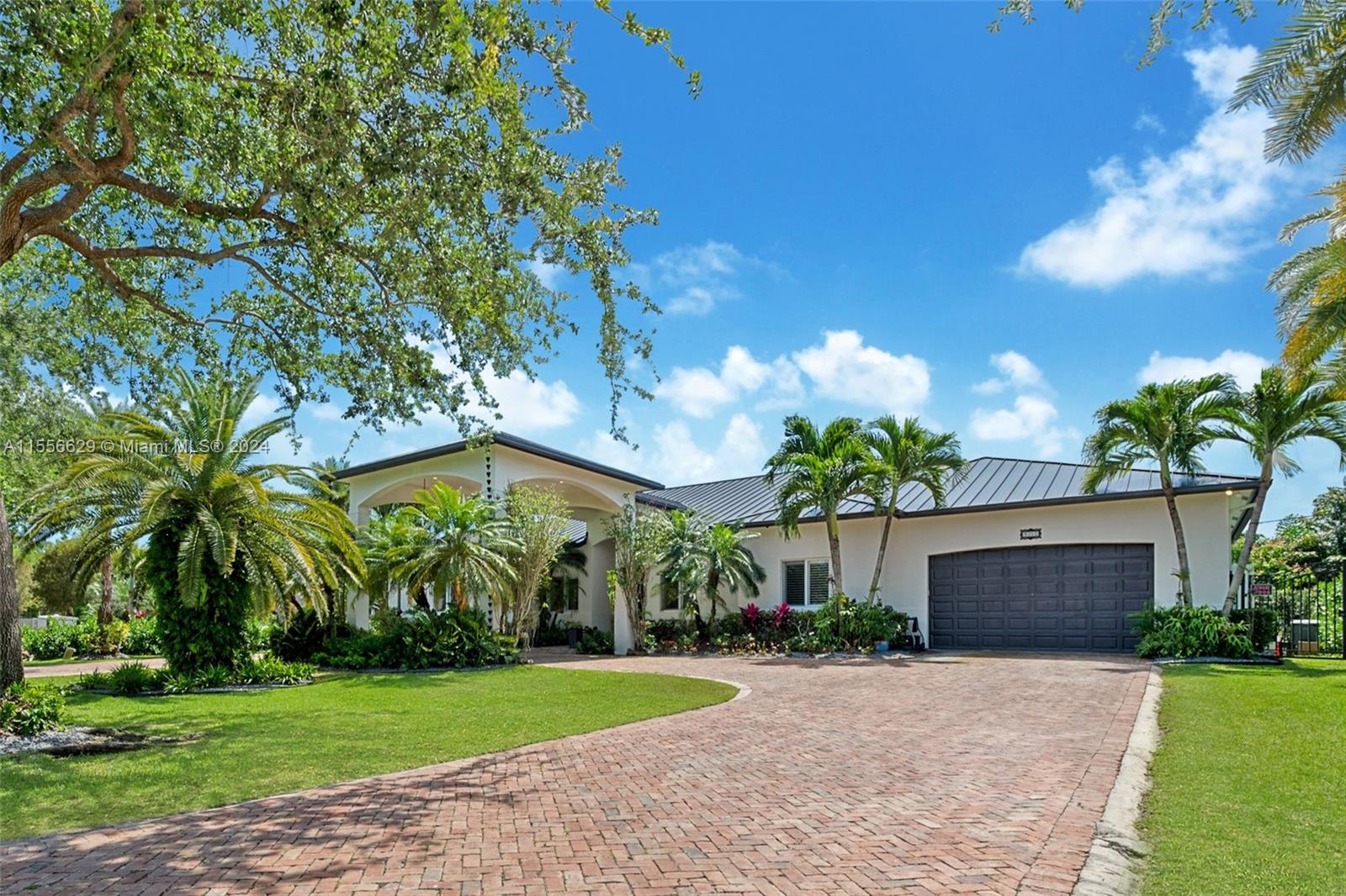 Come discover this captivating 1-story home with 5,319 sf in Palmetto Bay.  Enjoy 5 bedrooms, 1 office, and 5 baths in this modern oasis. Revel in marble floors, a lavish master suite, and a gourmet kitchen. Outdoors, find a fully-equipped gazebo with an outdoor kitchen, custom made coral rock firepit, and pristine pool, perfect for an entertaining lifestyle. Updated in 2021 with a new roof, A/C, and freshly painted exterior. In addition this home includes plantation shutters, impact windows & California closets throughout. Located on a quiet desirable street, near top private schools such as Palmer Trinity and Westminster Christian, and beautiful parks, this home offers a perfect blend of luxury and convenience. Your dream Palmetto Bay lifestyle awaits!