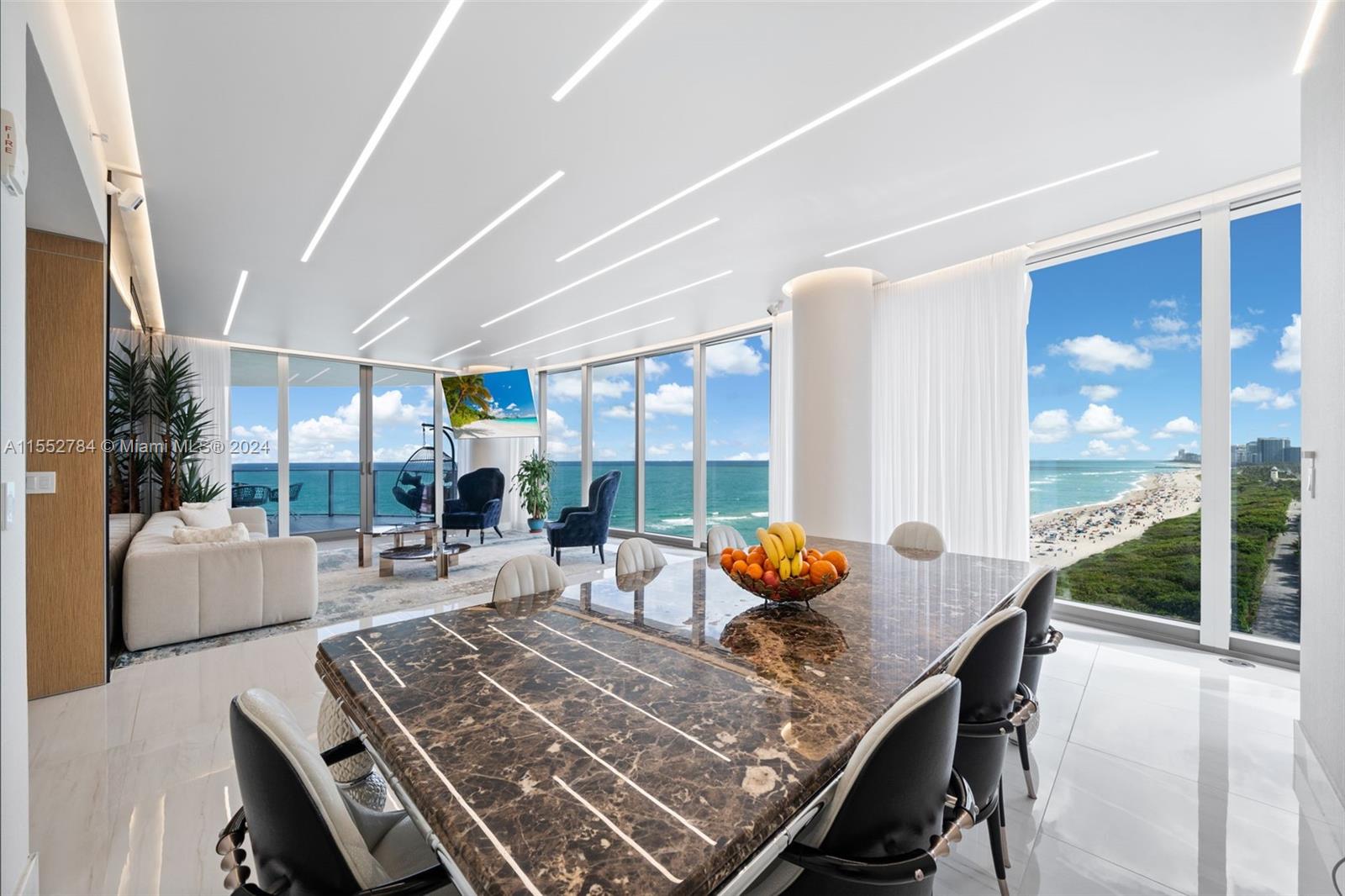 Most desirable southeast corner unit at the Ritz Carlton Residences. First floor to clear the building next door, offering gorgeous natural light and unobstructed ocean, intracoastal and skyline views. This 4-bedroom + maid quarters and 5.5-bathroom residence totals 3,640 SF (per developer). Meticulously finished with the most intricate details – Velum illuminated stretch ceilings, Italian wallpaper & tile, high-end closet buildouts, automated window treatments. Private elevator landing and 4 balconies. Amenities include 2 pools, spa, gym, beach/pool service, restaurant/bar, room service, club level lounge, valet, 24-hour concierge. Unit comes with 2 valet spaces and one deeded space. Buyer has an option to purchase up to THREE more deeded spaces from the seller. Furniture negotiable.