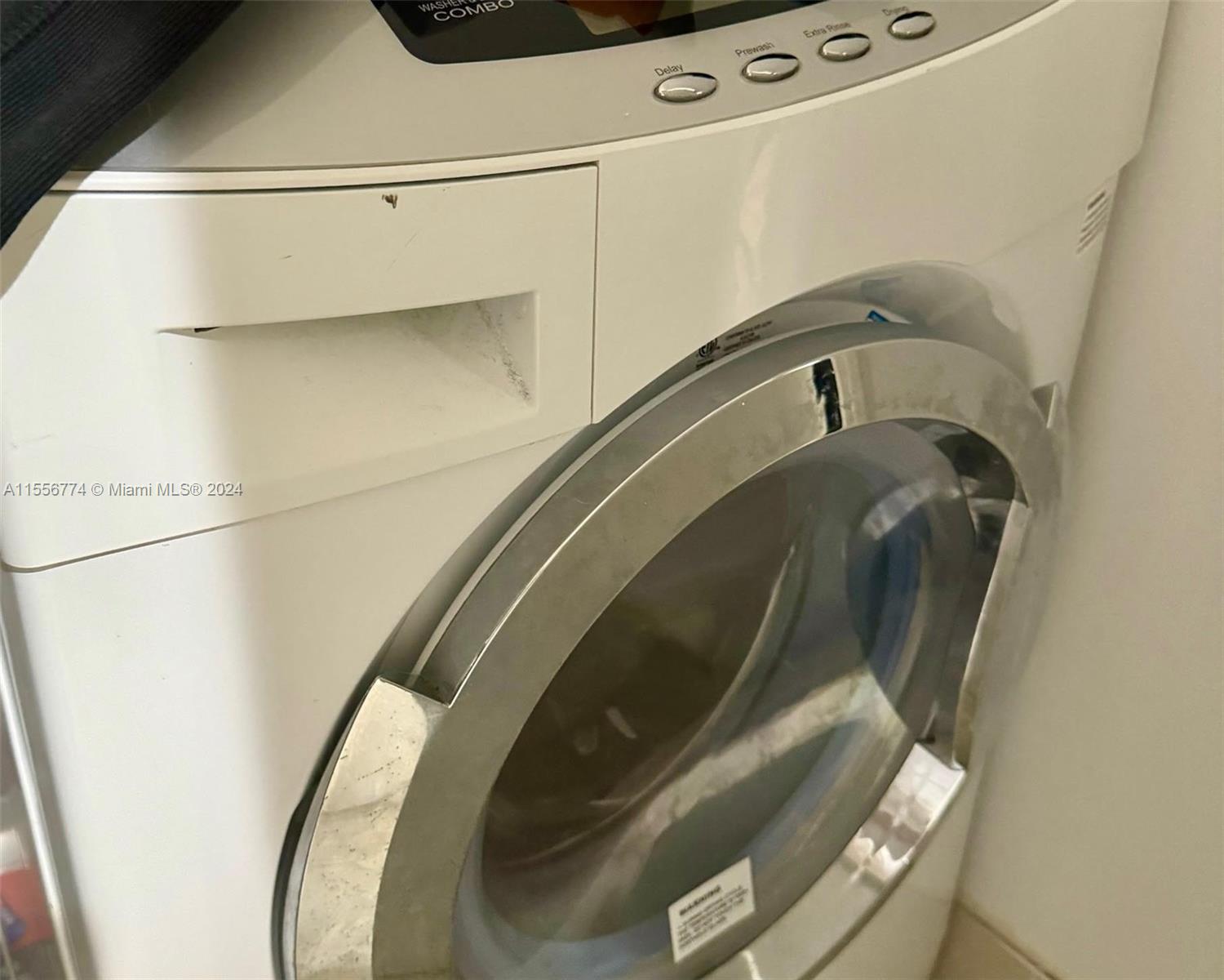 Washer/Dryer Unit (located behind Bathroom door)