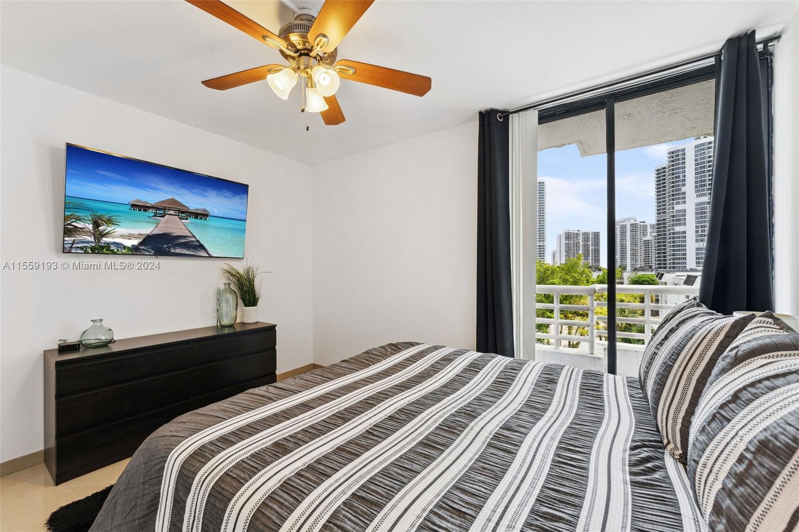 Secondary bedroom complete with private balcony.