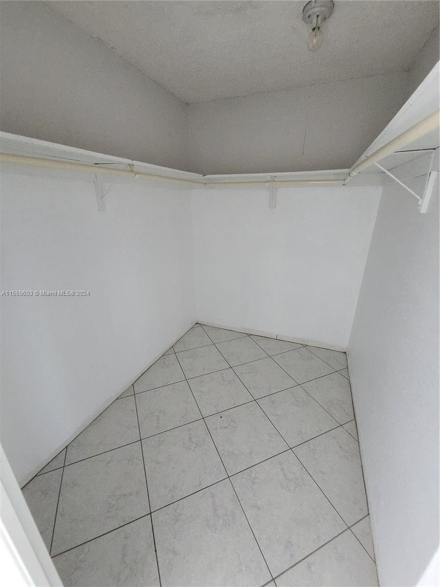 Walk-in closet of master bedroom