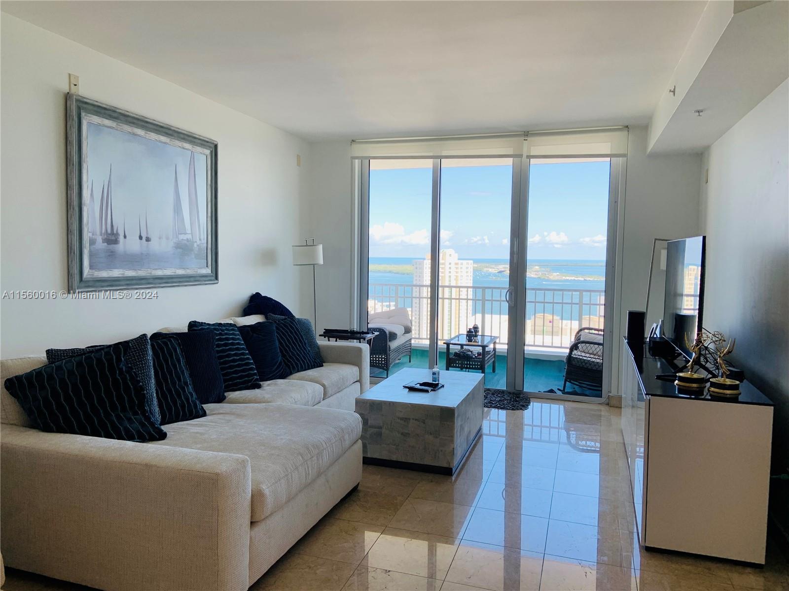 Unobstructed views of bay and skyline from this high floor residence in prestigious Brickell Key Island. The property features high ceilings, marble floors in living areas, carpet in bedroom, lots of natural light, open kitchen with granite countertops. Courts Brickell Key is a full service building, meticulously maintained  with well equipped gym, racquetball and squash courts, inviting pool area by the bay, hot tub, 24 hrs lobby concierge, complimentary valet parking for your guests and professional management on site. Assigned and covered parking space included. Must see to appreciate.