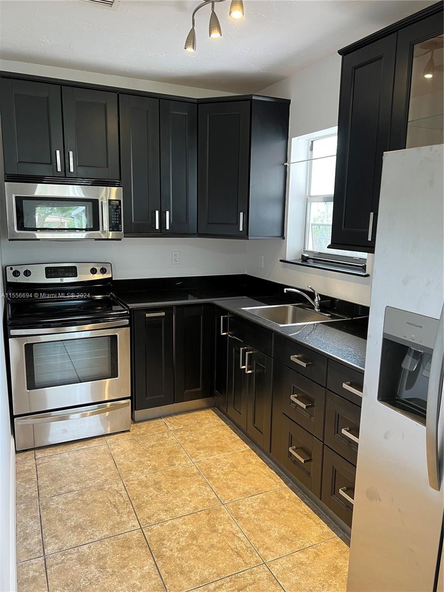Kitchen with Brand new Fridge