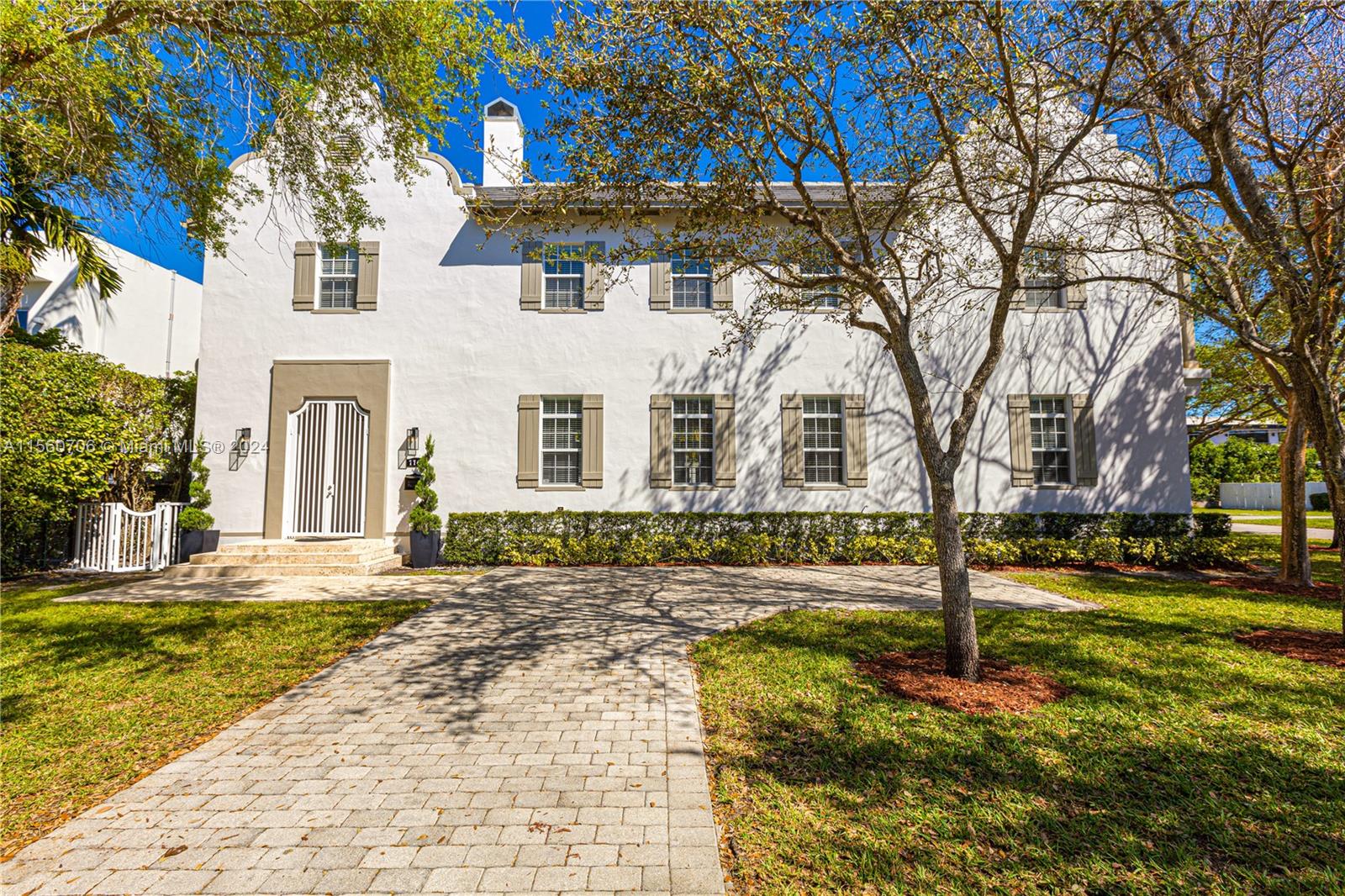 Exquisite luxury meets understated elegance in this corner lot residence nestled in the tranquil and central Miami neighborhood of High Pines. This home features 6 bedrooms and 6.5 baths, including two bedrooms and baths conveniently located downstairs for versatile living. Additionally, this home boasts a separate 1-bedroom, full-bath guest quarters above the garage, ideal for hosting visitors, creating a private home gym, or a quiet home office. A true architectural masterpiece by renowned Miami architect Cesar Molina of CMA Design INC., it  showcases a Dutch Caribbean architecture style, enveloping you in the feel of a luxurious tropical resort. This home offers the best of Miami living, with proximity to top-rated schools, parks, dining, shopping, and major transportation arteries.