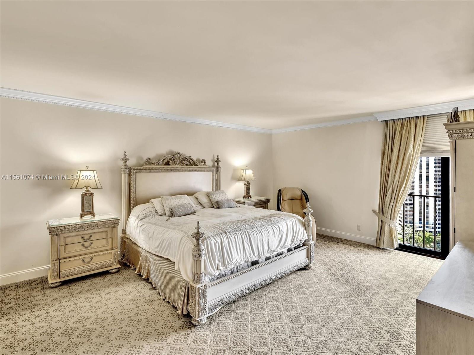 LARGE PRIMARY BEDROOM SUITE HAS WATER VIEWS AND HUGE WALK IN CLOSET