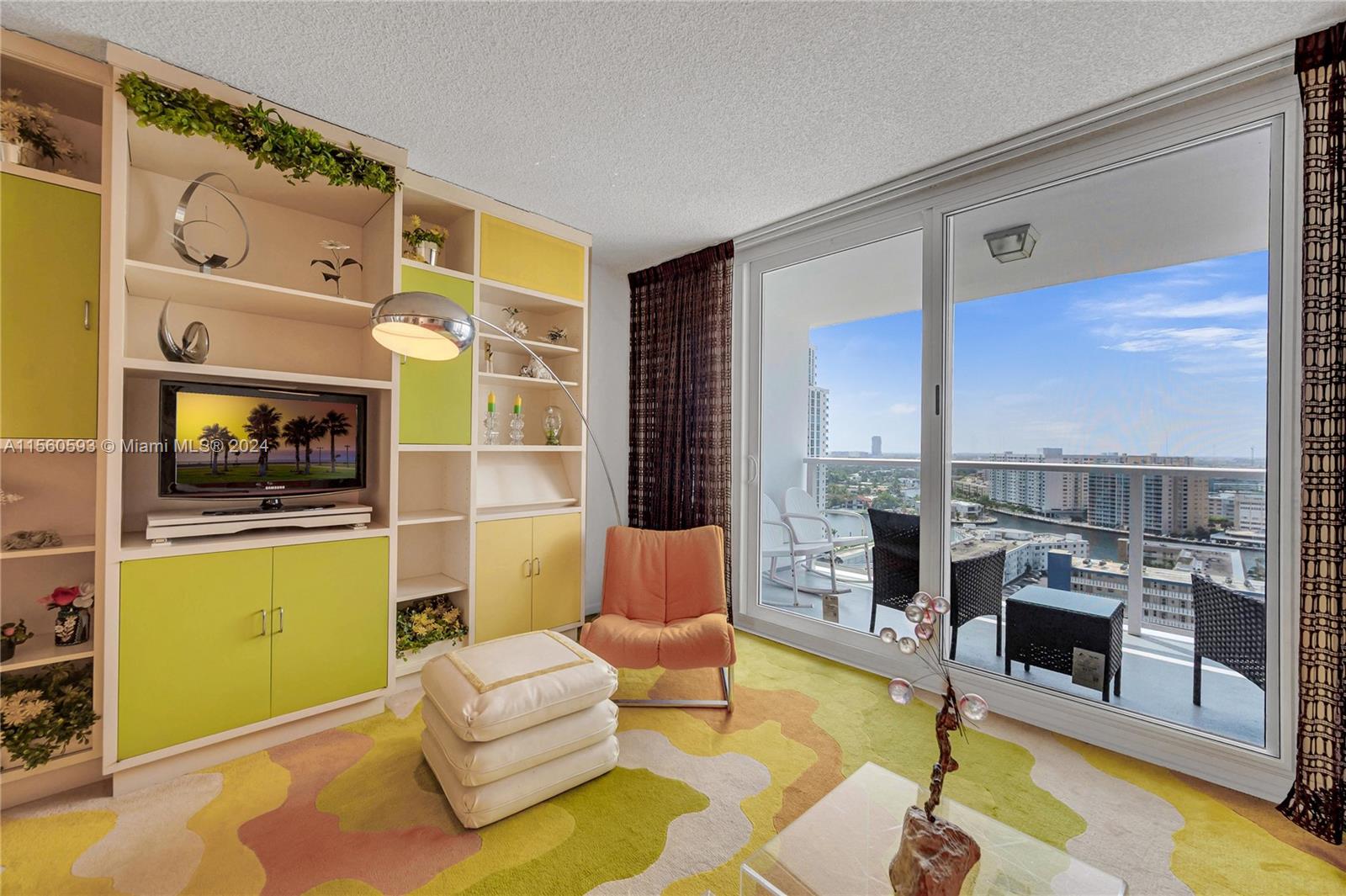 Built in wall unit and carpet in the living room. Impact windows done recently