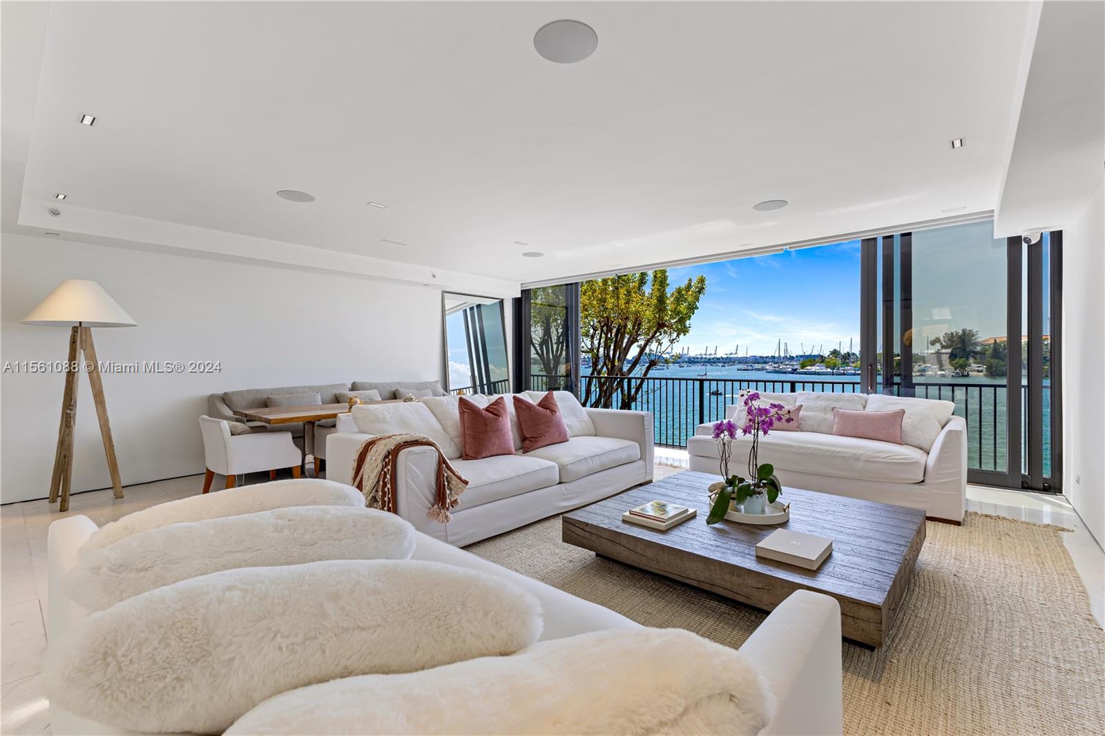 Live on the Venetian Islands without the $15M price tag! This newly renovated 4-story townhome boasts 4 bed 3.5 baths with 4,323SF of living space and offers stunning views of Biscayne Bay and the Miami Skyline.  Features include marble floors, gourmet chef's kitchen with SubZero refrigerator, induction stove, Bosch appliances, custom kitchen cabinetry, pre-wired automation for Control 4, new AC’s, elevator and motorized shades.  Crowned by 1,500/SF of rooftop terraces with an outdoor kitchen and hot tub makes the perfect setting for entertaining.  2 parking spaces including 2 Tesla chargers and 1 space inside the garage.  Enjoy the best of single-family living with the abundance of amenities and security provided at the iconic 1000 Venetian.
