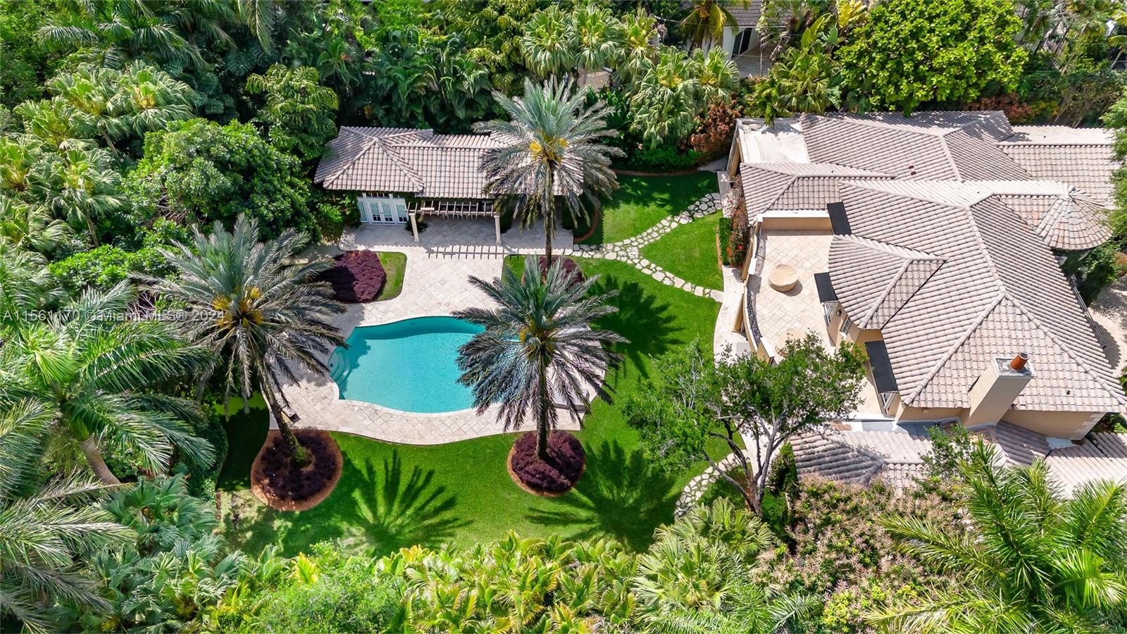Located in the heart of Coral Gables on a CUL DE SAC behind a private gate, this property offers 7,787 LIV SQFT, 6-bedrooms, 6.5 bathroom, plus a den and a 3 CAR GARAGE. Sitting on a 42,253 SQFT LOT, this property is full of LUSH landscaping full of oak trees. The MASTER SUITE wing is DOWNSTAIRS and also includes a private den ideal for a home office. UPSTAIRS, find three bedrooms, each with terrace access and ensuite. Step outside to discover a private paradise; the backyard features a large pool, an outdoor kitchen and bar, an outdoor dining area, and plenty of poolside lounging space. Property includes a separate GUEST HOUSE with a bedroom and full ensuite bathroom. House may be bought with furniture and fixtures for additional consideration.
