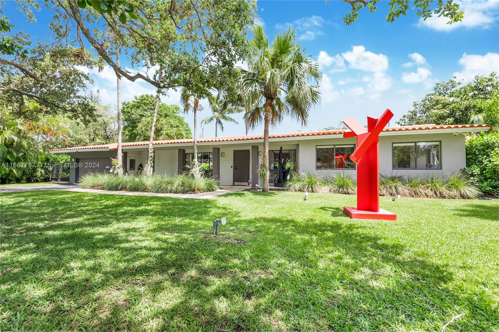 Gorgeous one-level home boasting impeccable landscaping on a 17,644 square foot lot in Pinecrest. Partially furnished, revel in an expansive layout featuring a formal living room and dining room with uninterrupted views of the backyard. The kitchen is ideal for culinary enthusiasts, complete with a breakfast area, glass wine cellar, and a family room/home office. Step out to an extraordinary outdoor haven with a covered terrace, generous swimming pool, and abundant yard space. Notable features include impact doors, marble floors, smart home integration, a converted garage, cabana bath, and laundry room. Near elite Pinecrest schools