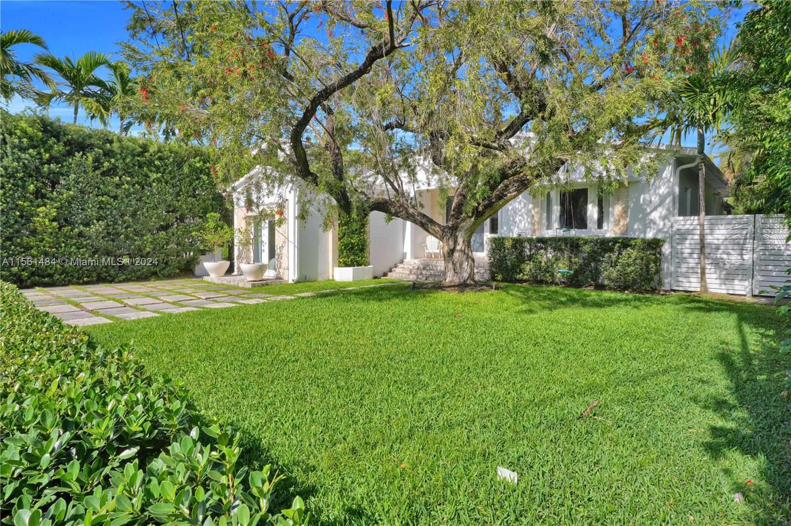 Welcome to this modern Art Deco home on prestigious La Gorce Drive. Spacious layout, open-concept design, new impact windows/doors, and wide plank hardwood floors blend elegance with functionality. Two living areas and an expansive dining area provide ample space for relaxation and entertaining. Four bedrooms, three full baths (including elegant master spa-bathroom), and split bedroom floor plan provide privacy and comfort. Sliding glass doors lead to covered Ipe wood deck and saltwater heated pool, offering seamless indoor/outdoor living. Lush landscaping creates serene backyard oasis. Convenient location on quiet street, less than a mile walk to beach, easy access to Miami Beach amenities and A-rated schools. A lifestyle of luxury and convenience awaits in this wonderful home!