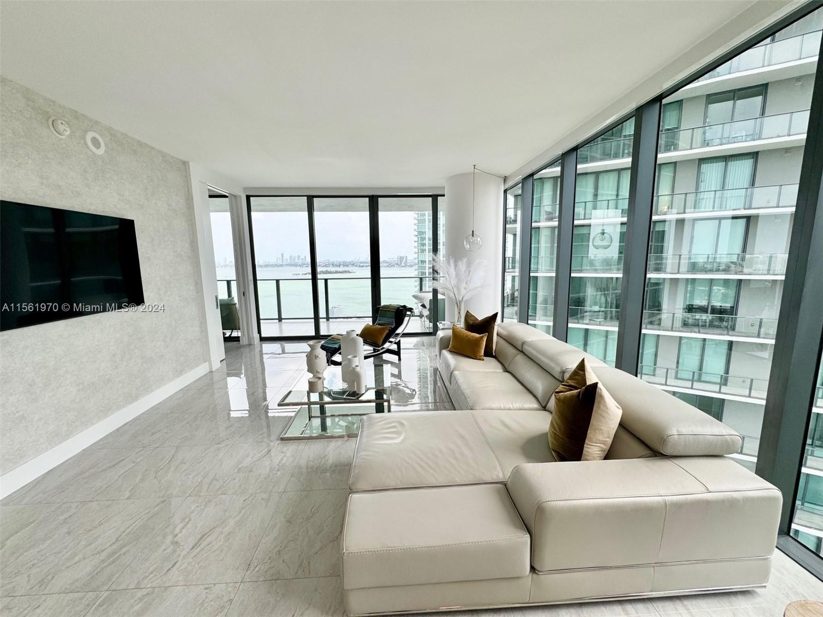 Stunning modern corner unit in the luxurious Paraiso Bay. With 1,646 SF, and 300 SF of terraces, this 3 bed/ 3.5 baths plus Den and private foyer apartment, is full of light. The East facing terrace overlooking the endless blue waters of Biscayne Bay and the Beach, give you the perfect sunrise views, while the West facing terrace, allows you to enjoy the most incredible Miami Sunsets! The unit features high end upgrades with spot lighting, customized closets throughout, motorized shades, additional built-in pantry.  Fully Furnished and available for rent until Mid Nov 2024. Enjoy resort style amenities: Signature restaurant / Amara Beach Club by the Bay; Olympic size circular zero entry pool; tennis courts; putting green; bowling alley; screening room; fitness center; spa;