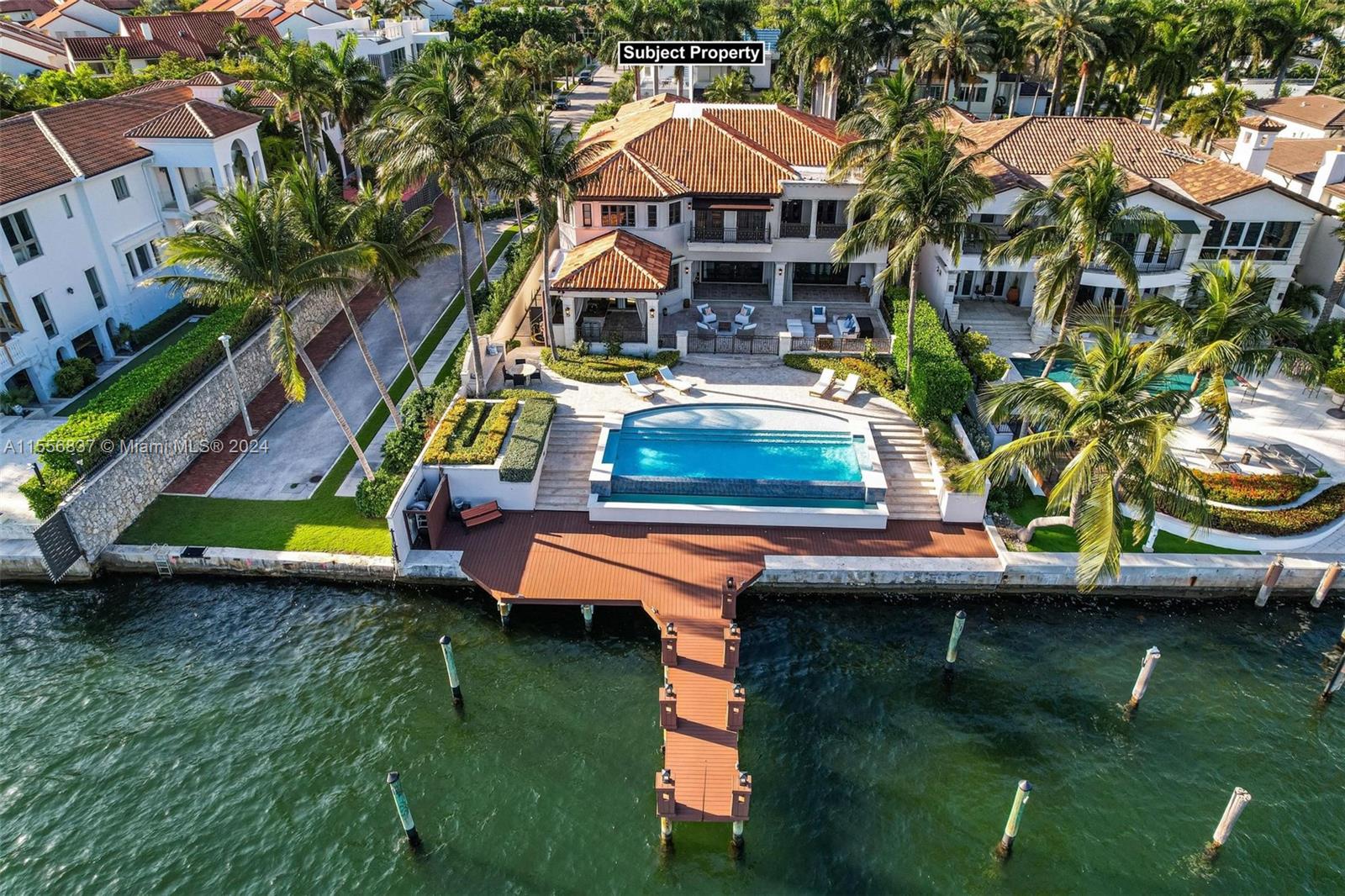 Spectacular Mediterranean home with incredible unobstructed views of Biscayne Bay. This 2-story waterfront residence sits on 2 lots on a quiet street with a gated entrance in Coconut Grove. Features of this 6BR/5+2BA home include a chef's kitchen, two refrigerators & gas range, Viking & Subzero appliances, 2 large wine storage cabinets, custom millwork throughout the home, movie theater, detached 2-bed guest house, & 3-car garage. Outdoor highlights include brand new private dock, infinity pool, covered summer kitchen, and 70 ft of water frontage. Fully gated & walled, with neighborhood security patrol and only one immediate adjacent house, this property feels like a private compound. This is a must see, and will not last. Actual Sq ft: 7,521. By appointment only.