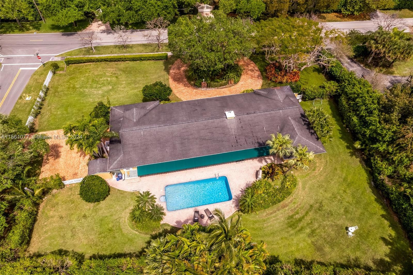 The perfect family home, sitting on an oversized 32,000+ sf. CORNER lot in the heart of Pinecrest. You'll be greeted by an open floor plan that seamlessly connects the family, living, dining, & kitchen areas.  Generous room sizes, expansive views, & access to the backyard/pool area & large covered terrace. Grand-sized living & formal dining room with marble floors. Oversized office or studio with an independent entrance & Chicago brick driveway. Chef's kitchen with large breakfast area. New A/C in 2023. Impact doors and windows bring abundant natural light in. Rainsoft reverse osmosis water filter for the entire home. Ample storage throughout the house and a spacious storage shed. Ideal location, close to Pinecrest and Palmetto Bay's best Schools.
