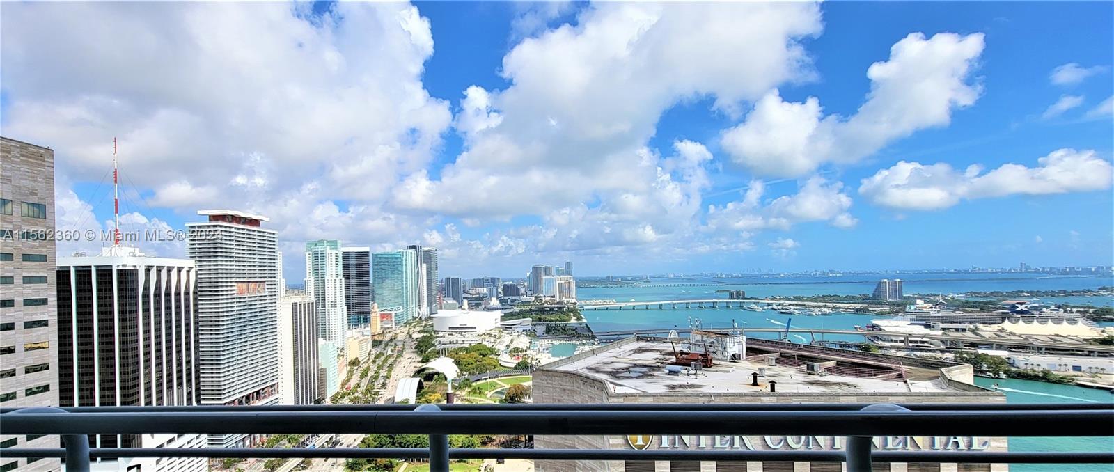 Exclusive Lower Penthouse condo with 2 Bedrooms, 2 Baths & high ceilings. Soak in all of Miami with expansive view of the Skyline, Bayside & Arena, Port of Miami, Private Islands & Miami Beach right from your balcony! Unit features laminate wood floors throughout, marble bathroom counters, granite kitchen countertops and impact doors and windows to ensure a quiet retreat amidst bustling downtown. A waterfront stroll or jog along the river or a soothing ocean front yoga class are just an elevator ride down from the manned lobby. Situated at the edge of Biscayne Blvd & the Miami River, One Miami offers 2 pools, 2 gyms, party room, conference room, sauna, jacuzzi, 24-hr security guard gate, valet, concierge & onsite management office. HOA fees include water, internet & basic cable.