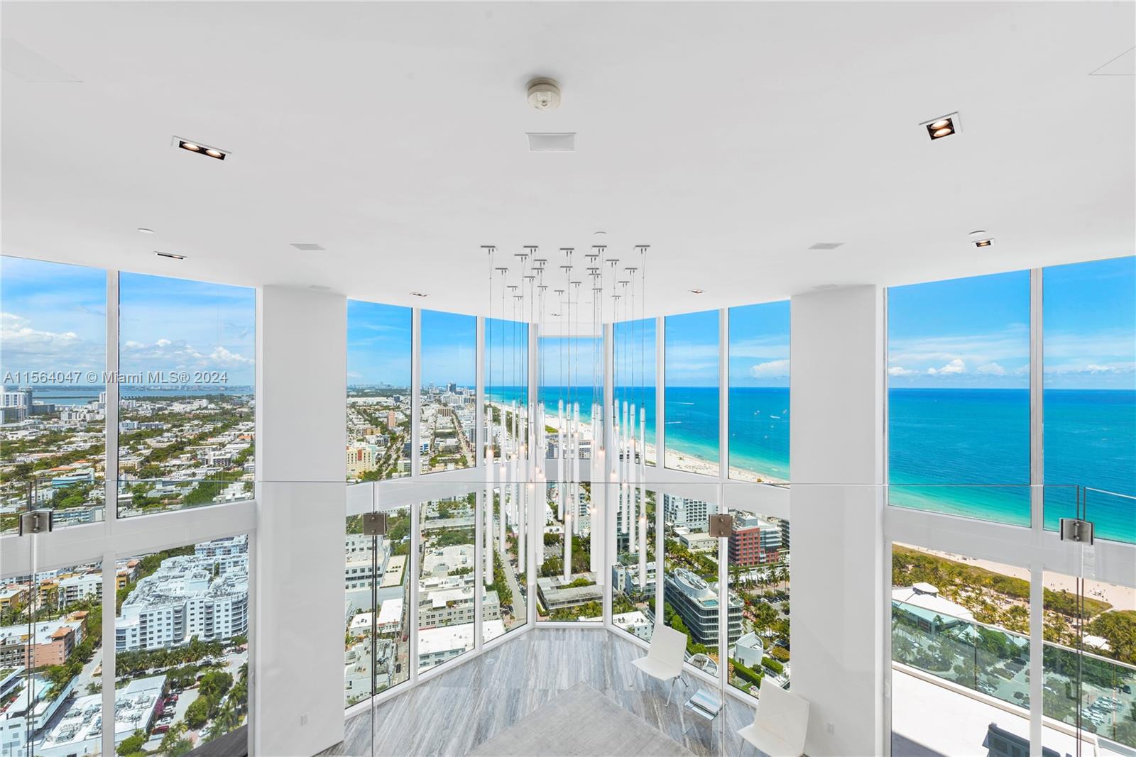 One-of-a-kind, 360 degree view, two-story Penthouse was recently transformed by renowned designer Sands Studios and sits in the heart of Miami Beach's iconic "South of Fifth" neighborhood. Offering 8,400sf of living space and a private rooftop, enjoy 360-degree views spanning the Atlantic Ocean to Biscayne Bay and the glittering skyline. This 5BR, 5-full and 2-half BA industrial/modern design offers unique finishes from a bank vault inspired door to a back lit honeycomb Onyx wall, 2 grand stairways, 18-ft ceilings, silver travertine floors, rare Mikasa wood, chef’s kitchen with seamless stainless steel and book matched Statuary Marble. Features include an interior elevator, private sauna/steam room and luxe building amenities with 24-hr security, concierge, pool/spa and fitness studio.