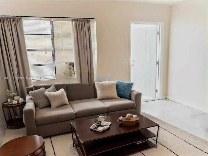 The unit is UNFURNISHED- This photo is VIRTUAL STAGED FOR VISUALIZATION