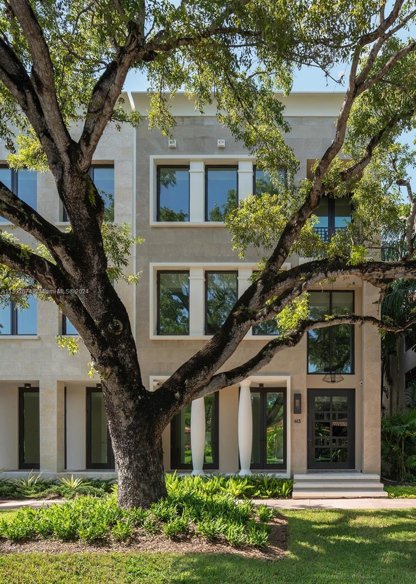 Welcome to your dream home in beautiful Coral Gables!This brownstone-style residence, built in 2021, stands proudly with four stories, featuring five spacious bedrooms, a four-car garage, exquisite custom millwork, and an impressive rooftop area complete with a pool and breathtaking views.The home showcases an inviting open-air courtyard, equipped with top-of-the-line appliances, while the bedrooms offer ample space, and the home office and gym can easily be converted into additional guest rooms or hobby areas to suit your lifestyle. Equipped with smart home technology, various security systems, and a meticulously designed home theater for sports enthusiasts. Convenient access to schools, upscale shopping, and walking distance from The Biltmore, Miracle Mile, and Granada Golf Course.No HOA