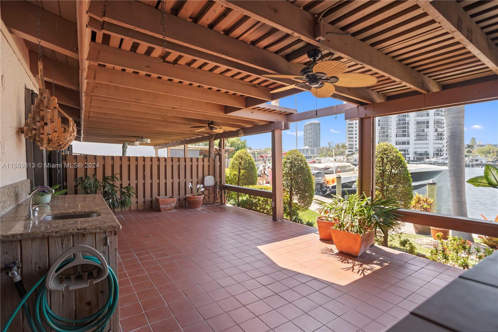 Covered Patio with lots of room to entertain or relax and watch the beautiful sunsets overlooking the deep water canal, no fixed bridges with ocean access.