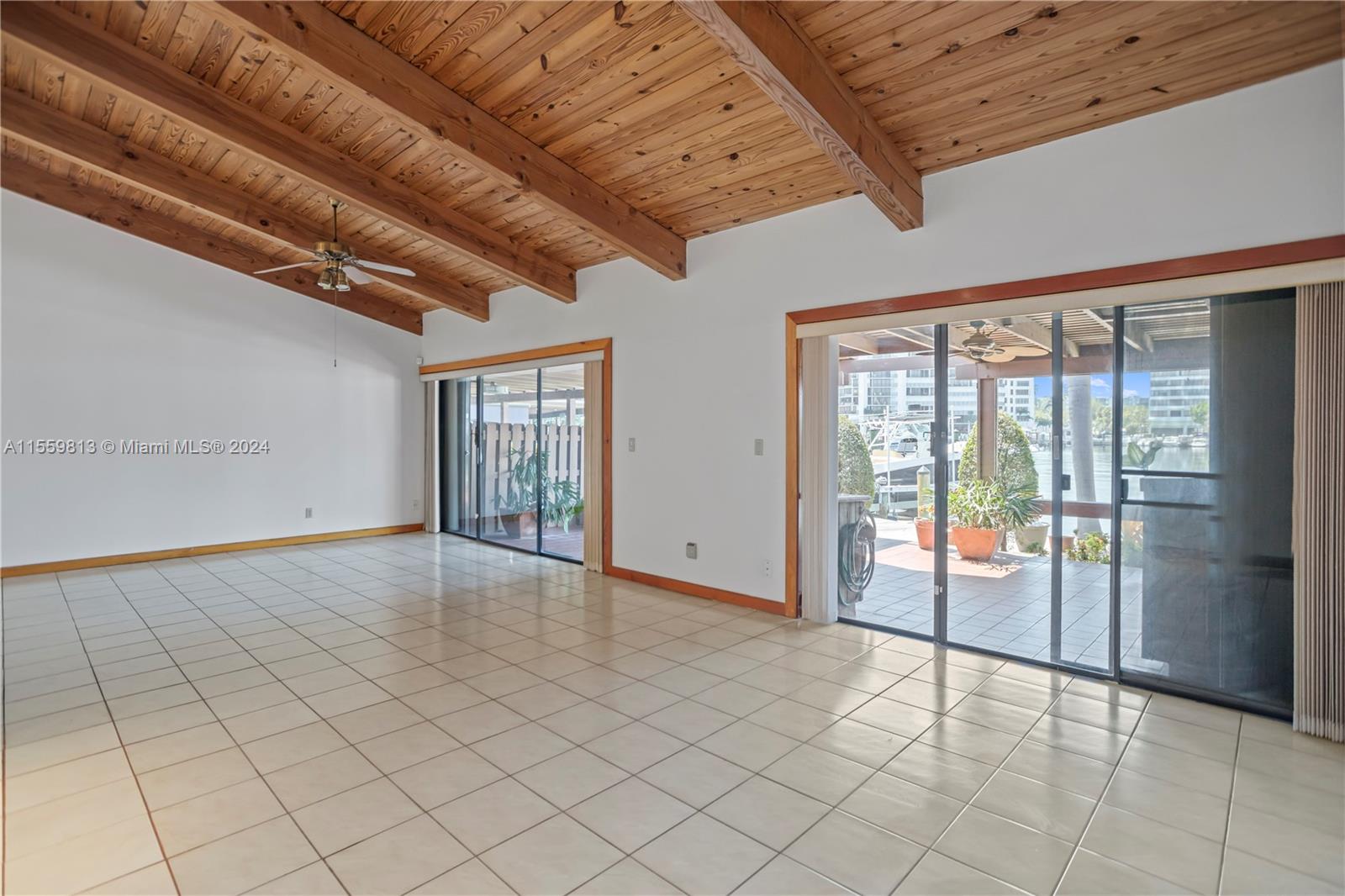 Beautiful high ceilings spacious living room that leads out to the patio & dock.