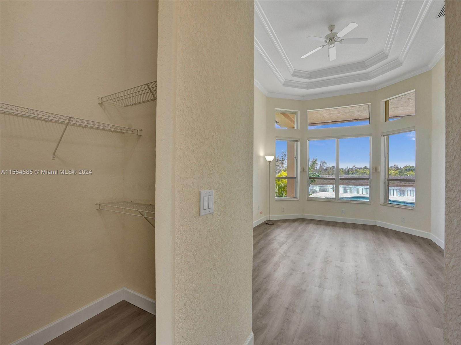 Primary suite enjoys his and her closets