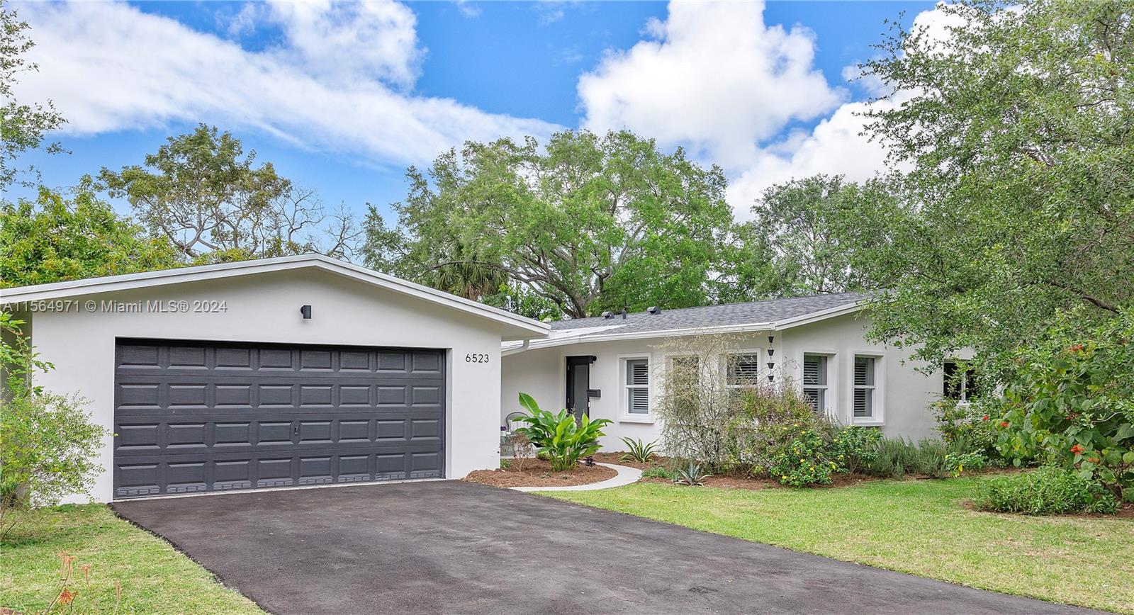 Renovated 3-bedroom, 2-bathroom family home situated on a prime corner lot in South Miami. This property boasts a newly updated kitchen with modern amenities, new flooring, and a recently installed roof, alongside other enhancements, ensuring it is move-in ready. The yard is a haven for gardeners, with a variety of native plants, herbs, and fruit trees, and offers sufficient space for installing a pool. This home features a substantial, detached 2-car garage with windows, providing versatile space and presents the opportunity for future expansion. Located in a highly desirable neighborhood, this home is ideally positioned near Dadeland Mall, Sunset Place, and the Metro, offering a prime living experience in South Miami. This property is an exceptional opportunity not to be missed.