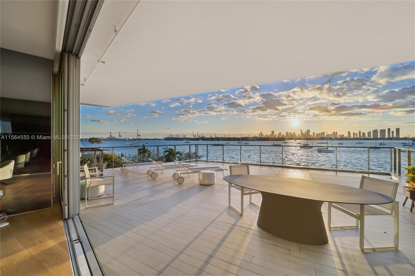 Monad Terrace #2f, designed by Ateliers Jean Nouvel, offers view of downtown Miami, direct bay views, and nightly breathtaking sunsets the best that Miami Beach has to offer. As you walk into this furnished unit by Artefacto via your private elevator and foyer, you will immediately notice the open interior layout along with private balcony and your magnificent waterview!  This unit boats floor to ceiling windows, wood and marble flooring, glass walls, marble island in the kitchen with Gaggenau appliances, custom made wine rack, stone tile bathroom walls, Calacatta gold showers and more. This is the only unit in the building with pool access via your private staircase. Relax and indulge yourself on your expansive  wrap around 2,422 sq.ft. terrace.   6 MONTH LEASE - AVAILABLE IMMEDIATELY.