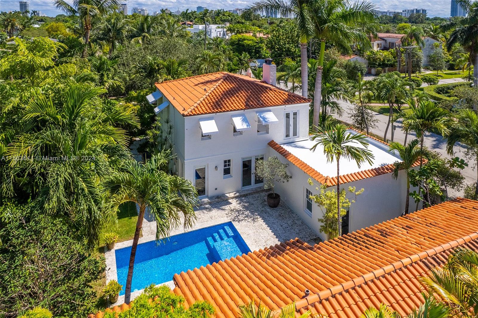 Beautifully restored Mediterranean pool home w/ guest cottage on quiet corner lot in Miami Beach. Large entry foyer, original wood floors, working fireplace, & abundance of natural light throughout. Contemporary eat-in kitchen w/ slate floors, Subzero & Bosh appliances. Spacious dining room overlooking the garden. Living room opens to both the pool area & private deck, great for entertaining. Second floor features the main bedroom w/ in-suite bathroom & 2 add'l bedrooms that share 1 bath. BONUS: Separate Guest house w/ 2 bedroom, 1 bathroom & large family room/ flex space, great for home-office or extended living area. Gorgeous tropical gardens w/ heated pool. Cabana bathroom. Two car garage w/ laundry & storage. Conveniently located steps from the beach, shops & places of worship.