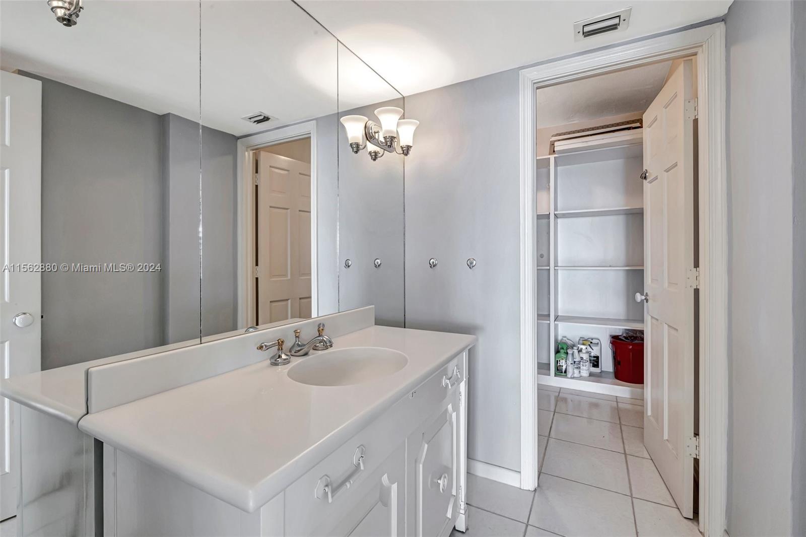 Powder Room w/ large storage closet behind