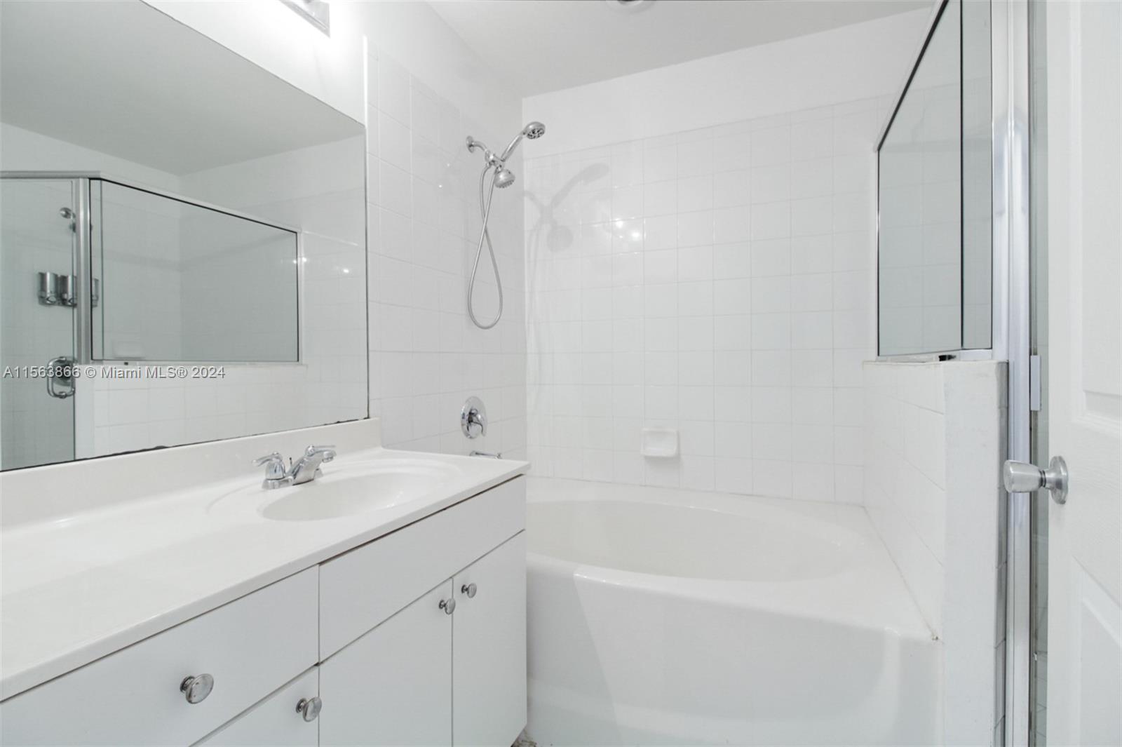 Bonus room where 1/2 the garage is particianed:  Man Cave, guest room, or other entertainment potential as sliding glass door leads out to community yard and small patio.