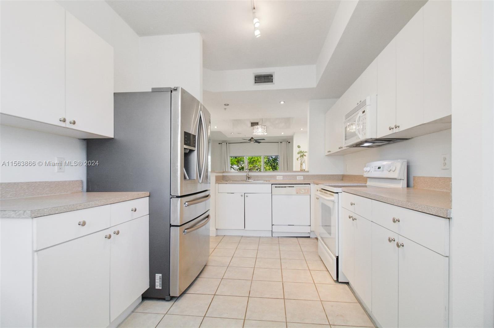 Eat-in kitchen perfect for coffee-table diner set up near windows.