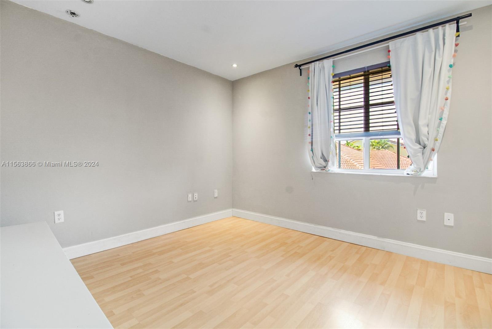 Master bed with en-suite bath, privacy door and opens to a Juliette balcony through sliding glass doors.  Ample light.