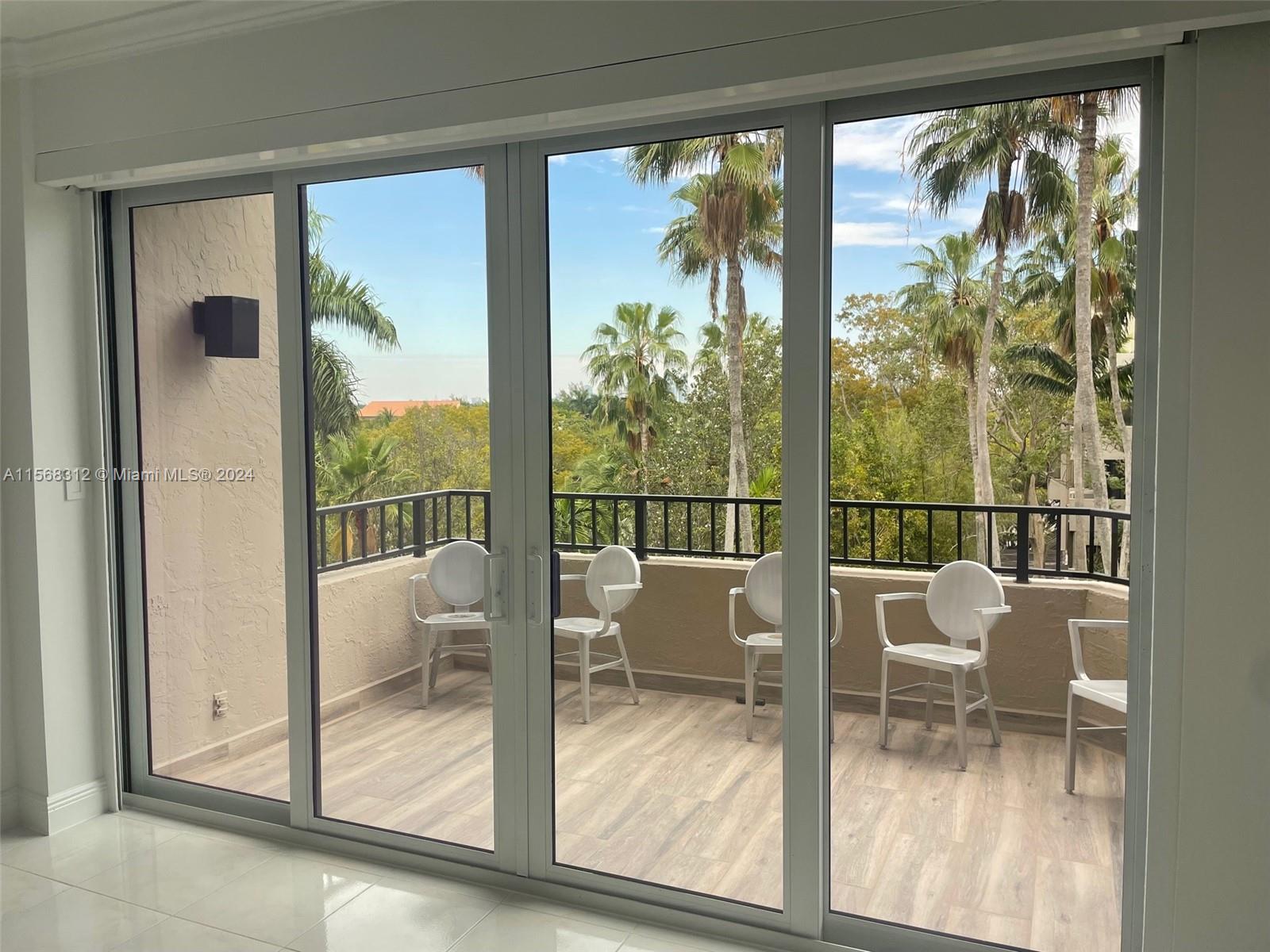 Two bedrooms, two bath, split-plan apartment overlooking the Emerald Bay lush gardens. Tiled floor throughout the apartment. Impact windows! One parking space.
