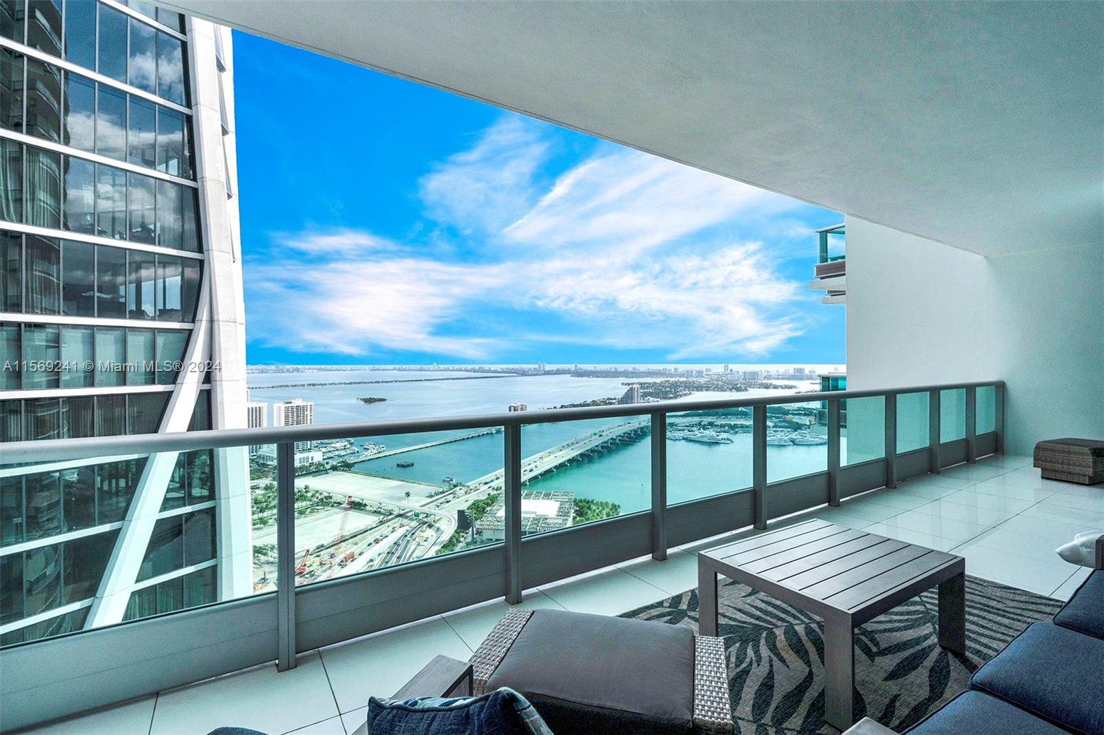 Beautiful and Luxurious Condo located on the 53rd Floor, with a private 10-Foot deep terrace overlooking Biscayne Bay, Museum Park, Venetian Islands & the Miami Beach Skyline. Views extend past Miami Beach to the Atlantic Ocean and as far north as the Sunny Isle Beach skyline. The condo is available fully furnished, with 2-Bedrooms + Den with a built-in Queen-Size Murphy Bed, along with 3-Full Bathrooms with walk-in showers. This unit offers a private elevator foyer leading into the interior space with 10-Foot ceilings, floor-to-ceiling impact windows, custom lighting, white marble floors, custom built-out closets, modern kitchen with chef's island, marble countertops & Miele/Sub-Zero appliances, custom-built wet bar, master bath with soaking tub & glass-enclosed shower & in-unit laundry.