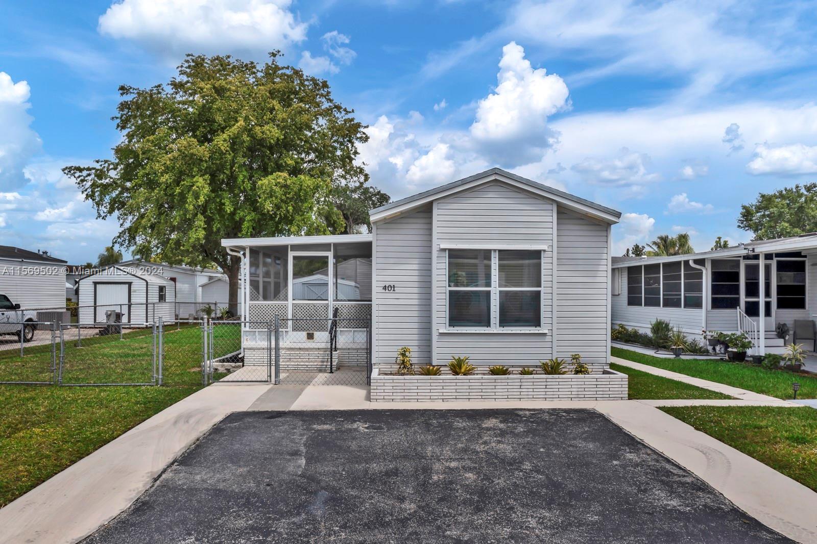 Welcome Home! This beautiful move in ready 2/2 manufactured home is located in Gateway West a 55+ community that you own the land. Property features tile flooring in main living area, wood flooring in bedrooms, split floor plan, new A/C and appliances in 2023, fully fenced yard and low HOA fees.  Community offers a clubhouse, pool and R/V or boat storage area for a low yearly fee. A Must See!