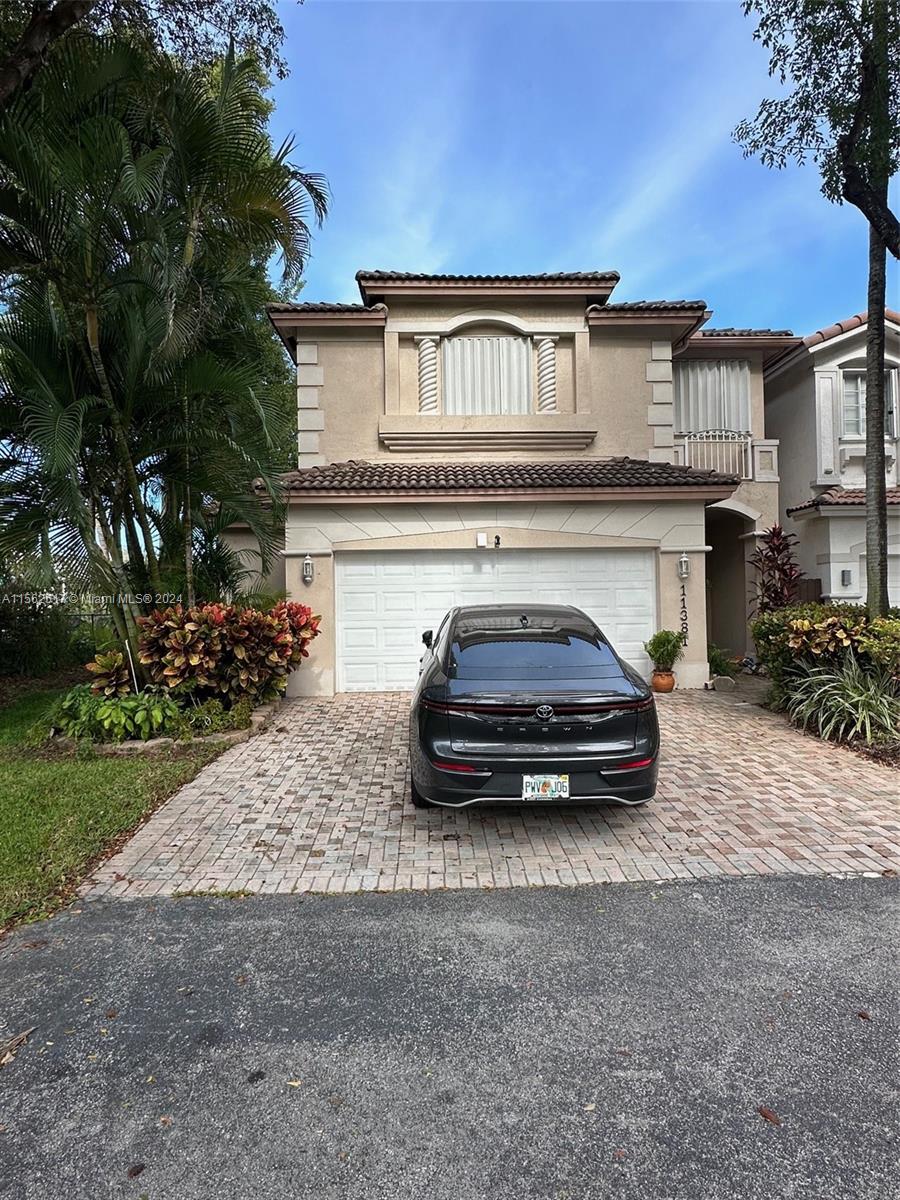 Resort style living in this spacious 4/2.5 DORAL ISLES Coach home with 2 car garage. Easy access to Fl Turnpike, 836 and 826. Close to shopping, MIA, and schools. Large master bedroom with walk in closet. Bonus office nook located on second floor. Community equipped with full GYM, pools, and hot tub all located in the club house. Easy to show, text LA or Co-listing agent for appointment.
