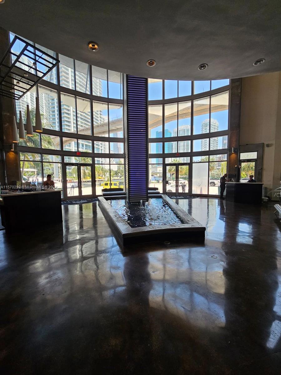 Spacious loft with balcony overlooking the pool area in a high rise on the River with gym, pool, assigned parking. Easy to show vacant unit.