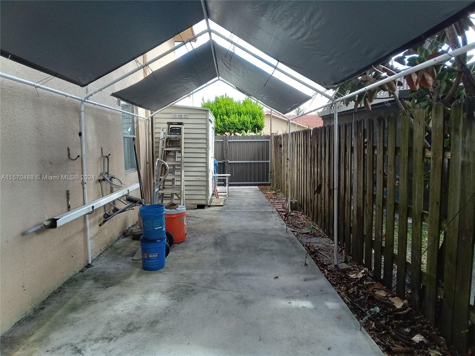 SHED ON SIDE OF THE BACKYARD