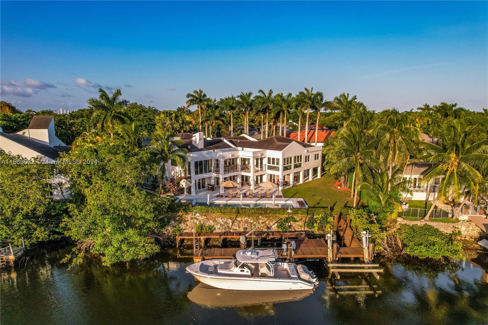Islands of Cocoplum fully gutted, re-designed by Pacheco Arch, re-built/expanded in 2017, oversized 20k+ lot, 119 ft WF on Lago Maggiore’s expansive views. Main level lofty ceilings, open water view features living rm, Mia Cucina Kit, family rm w/wrap around terrace. Formal dining rm. Bedrm wing incl 2 jr suites & main suite w/sitting area, glass walled office & top $ view, spa bath, double California Closet, all 5-1 AV. Lower level 2/3 & laundry/utility/staff +Bonus media rm with 7.1 system, bar/lounge all open to lap pool, spa, expansive deck, fully refurbished dock. Meticulous attention to detail, materials, lighting, smart controls, security, AV & appliances, chosen w/highest & most current standards for enjoyment & entertaining. Gated motor court for 20 cars, 3 car AC garage/gym.
