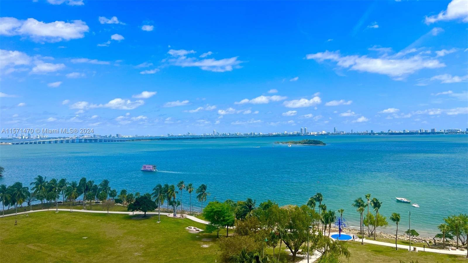 Amazing luxury condo with spectacular water views of Biscayne Bay and overlooking Margaret Pace Park. 14 ft ceilings. This apartment has 1 bedroom + den + 2 bathrooms with a large 400 sqft terrace. The property is exquisitely furnished and decorated. The building has many amenities: gym, pools, sauna, valet parking, concierge staff. All the amenities are on the 10th floor.