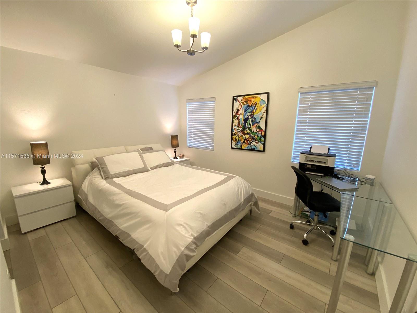 Spacious Master Bedroom - porcelain title flooring