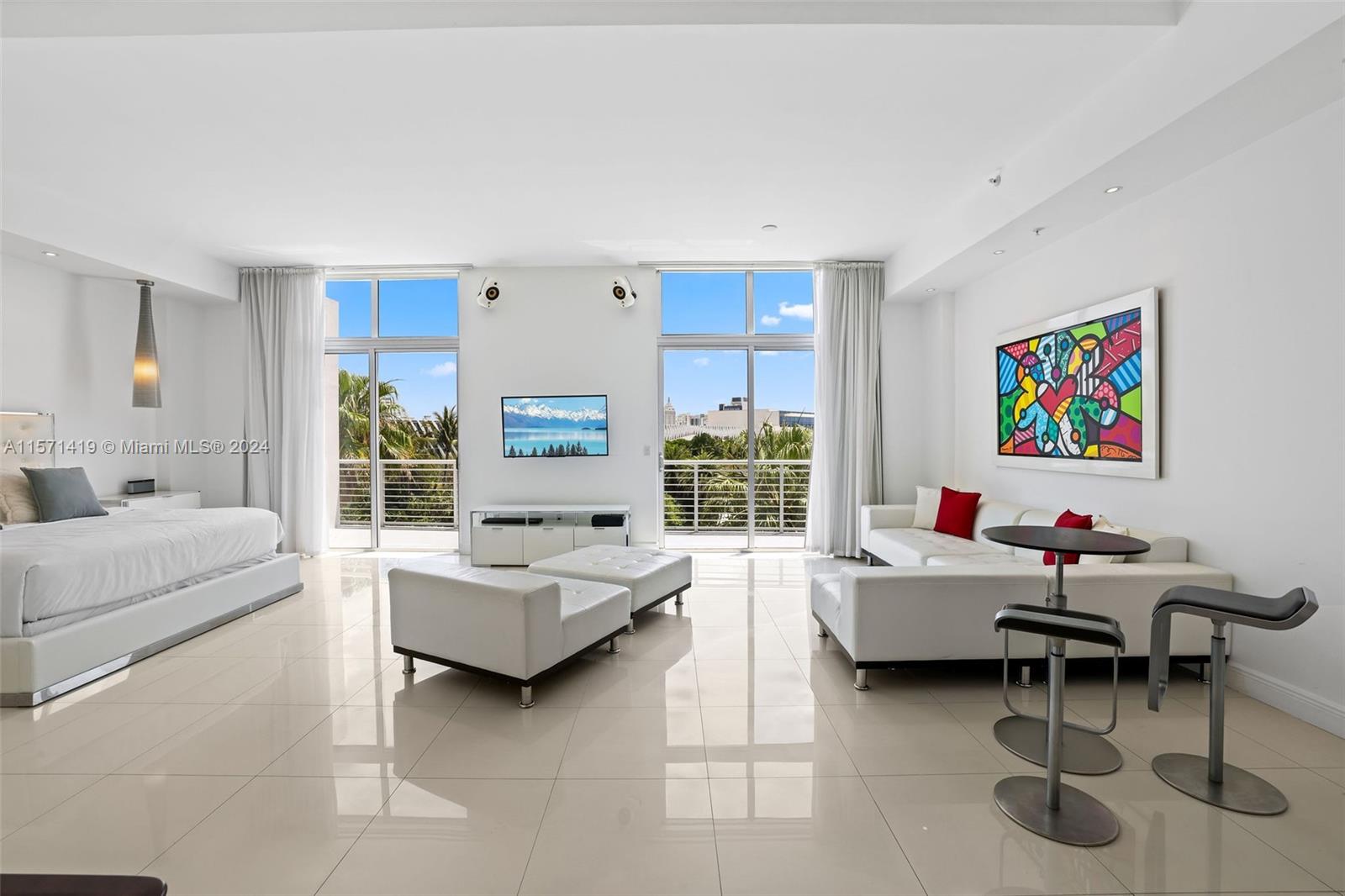 Welcome to this unique loft-style 1 bed/1.5 bath residences located at The Meridian Condo in South Beach. Walk into the unit and enjoy the spacious open floor plan that provides lots of natural light & has 11.5 foot ceilings throughout. Expansive terrace with views of Miami Beach Botanical Gardens and the city skyline. Assigned parking space in the building garage as well as having the convenience of a washer-dryer in unit. Located centrally just steps from Miami Beach Golf Course, Miami Beach Convention Center, and the vibrant energy of Lincoln Road, the beach, and Sunset Harbour. Building amenities include a 24-hour doorman/security, rooftop pool & hot tub, and fully equipped gym.