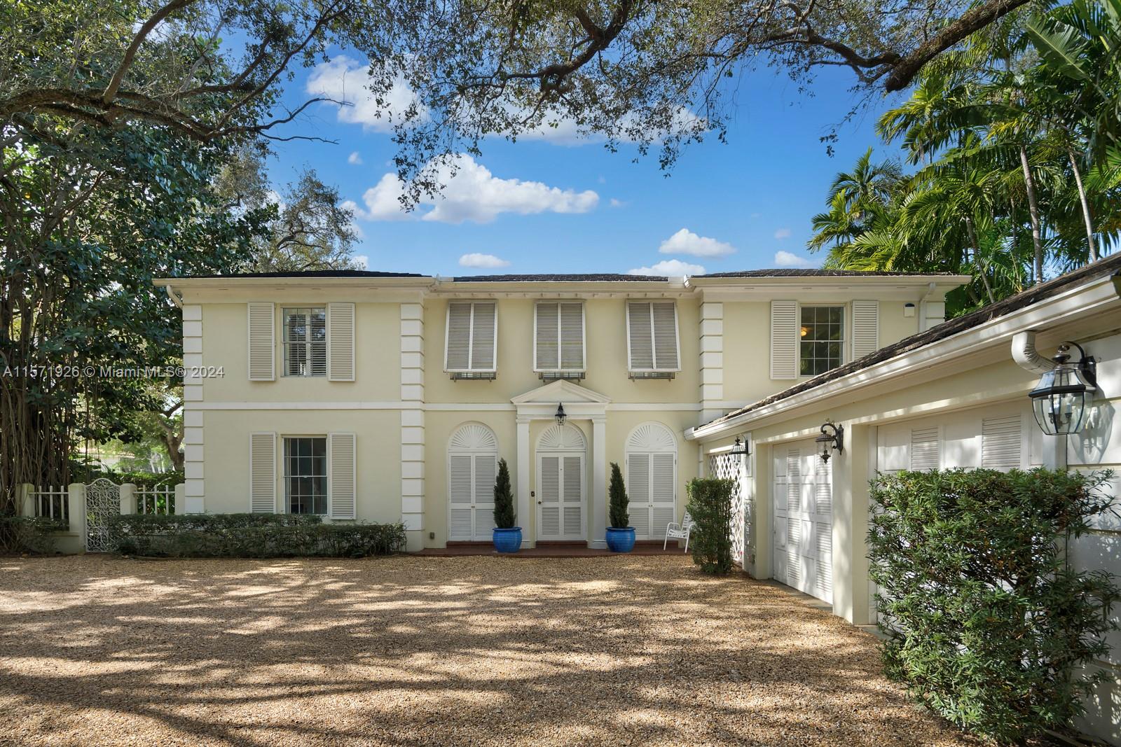 Located on coveted Santa Maria St, this residence overlooks the 15th green of the Riviera Golf Course. A Georgian jewel, West Indies accents, a one of a kind. An arched louvered front door welcome you into a light filled foyer & atrium with lattice work & soaring sky light. Den, Spacious living rm, grand fireplace & picture windows. Florida room and Formal Dining looks onto the charming patio & wading pool with golf course views. Well equipped chef's kitchen. Second level landing gives space for family room/office. Grand main suite with 2 large walk-in closets. Two sun-filled bedroom suites complete the 2nd level. The cart path arrives at the club house of the Riviera Country Club, a members-only club. Add'l features: staff qtrs (5th bed), 2 car garage, laundry rm. This home is a treasure!