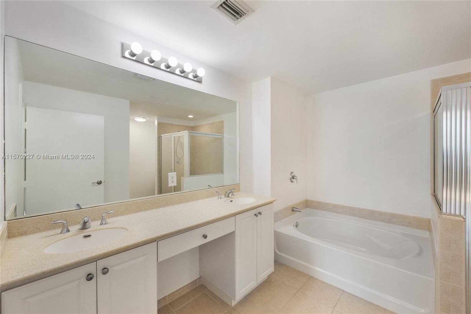 Master bathroom with dual sinks