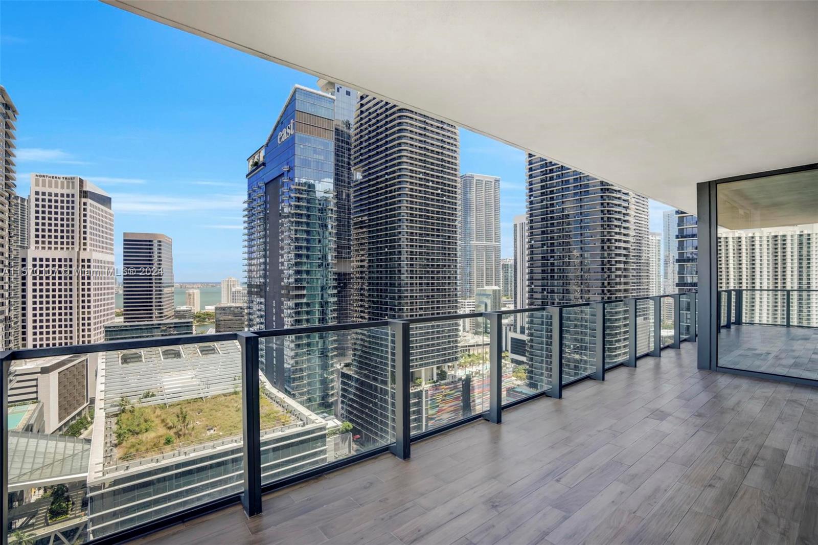 This fully remodeled 2-bed, 2.5-bath sanctuary boasts breathtaking sunrise views of Biscayne Bay and the City. Stride into elegance with 48x48 Gubi Porcelain tile flooring throughout. The modern kitchen features Italian cabinetry, honed marble countertops, premium Bosch appliances, and a wine cooler. Indulge in the primary bathroom's freestanding bathtub and stunning 120x120 Eco Ceramics wall tiles. 

Enjoy seamless indoor-outdoor living with a wrap-around balcony and floor-to-ceiling windows, complemented by electronic blinds in the bedrooms. Steps away from Brickell City Centre, The Rise Condo offers 5-star amenities, including a state-of-the-art fitness center, 24-hour concierge, valet services, heated pool, business center, child's playroom, Hamman spa, and steam room.